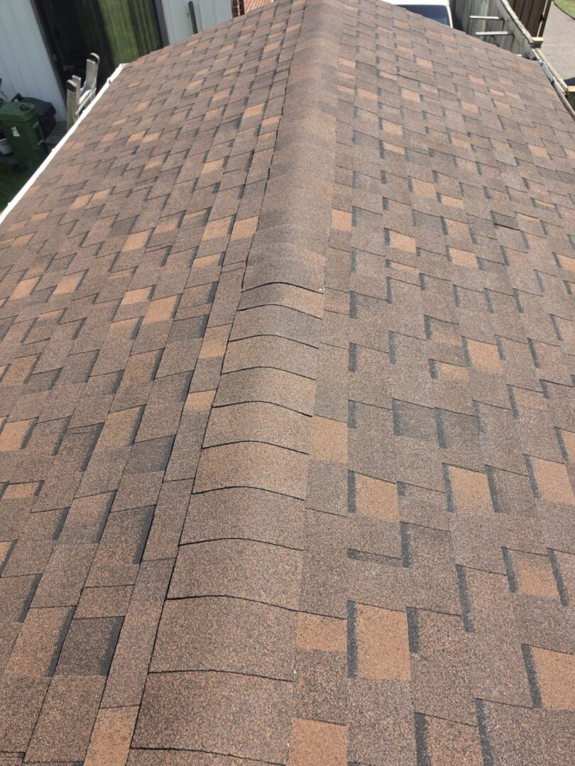 Finished shingle roof with clean ridge cap