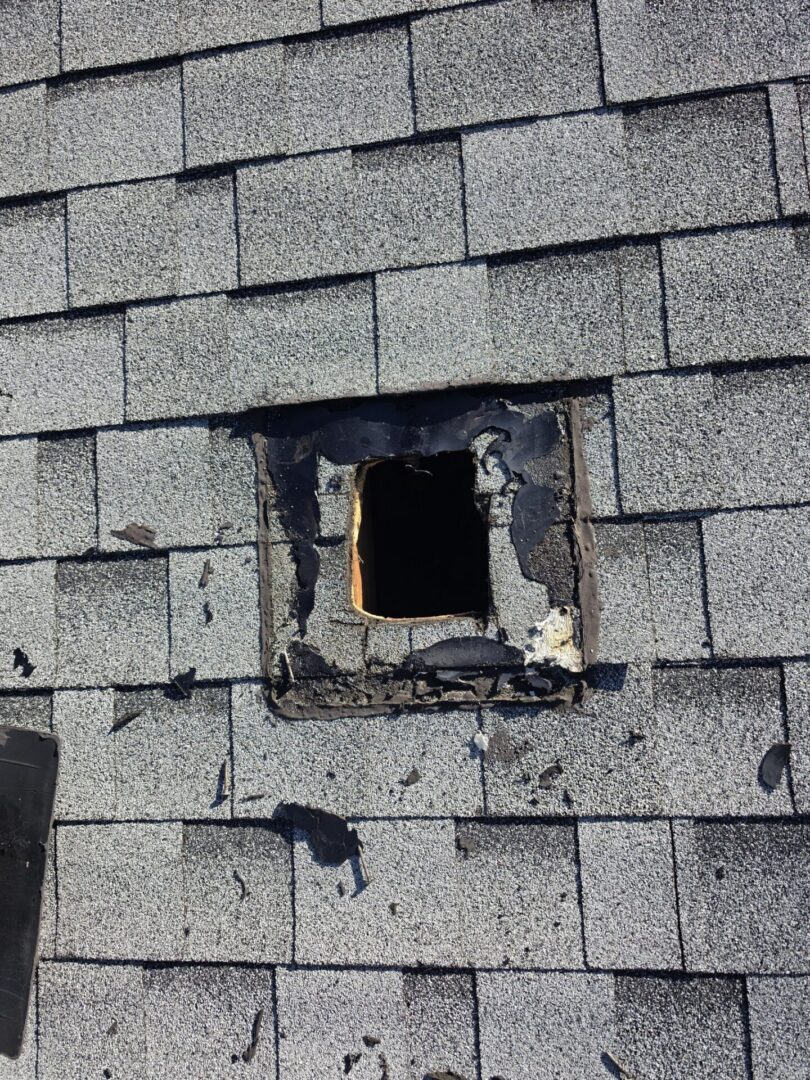 Torn roof vent before repair