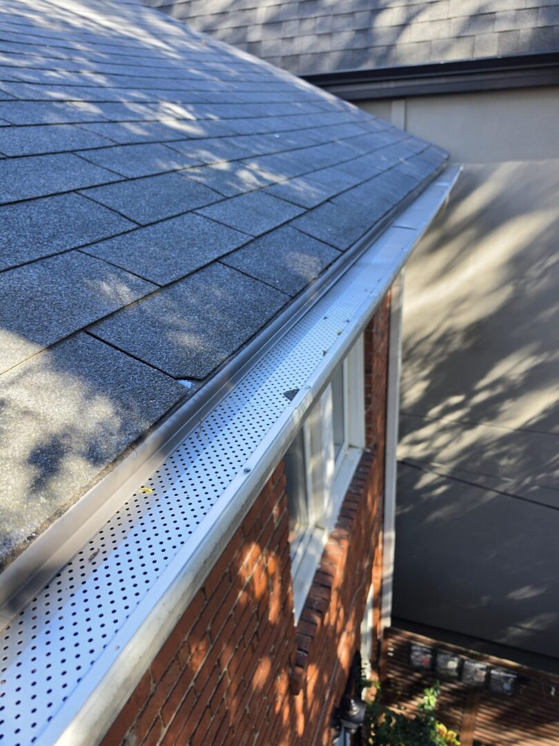 Clean eavestrough with new leaf guard installed
