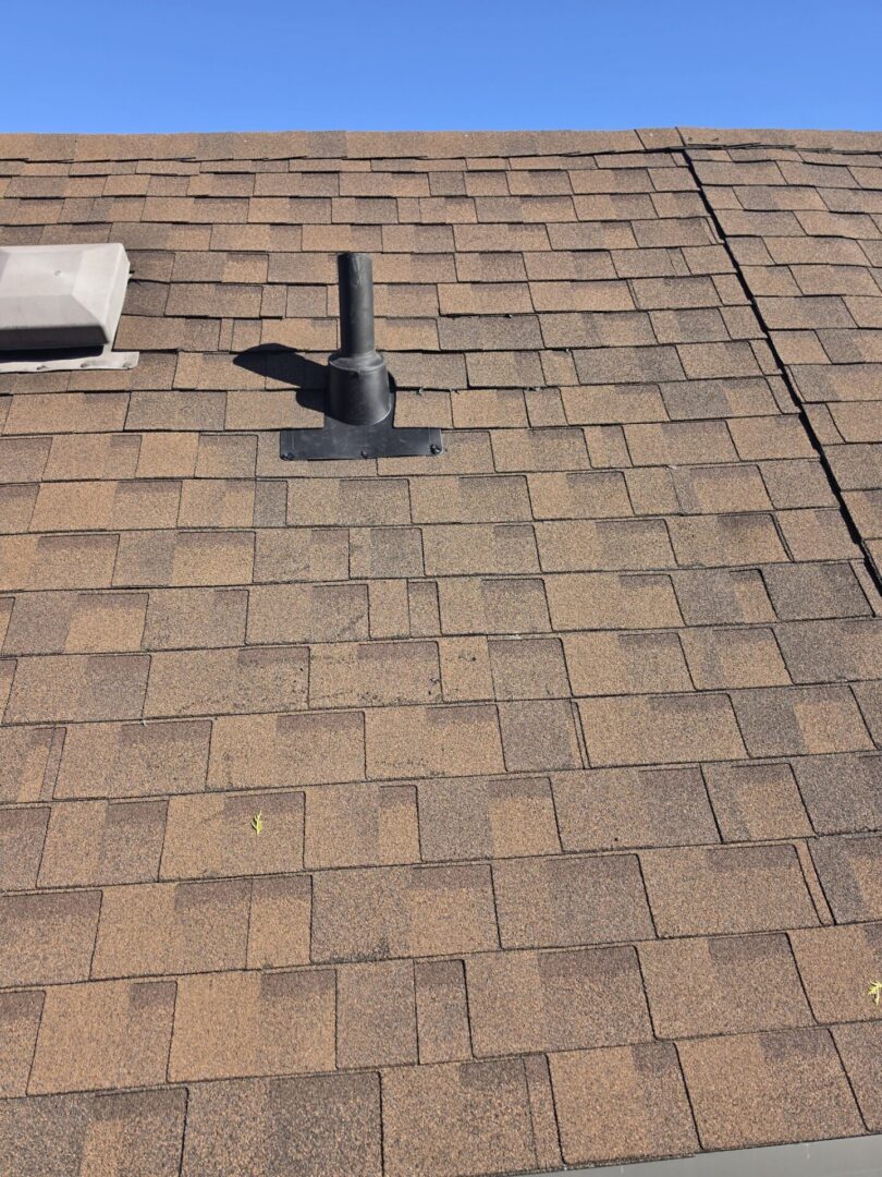 New shingle roof against blue sky